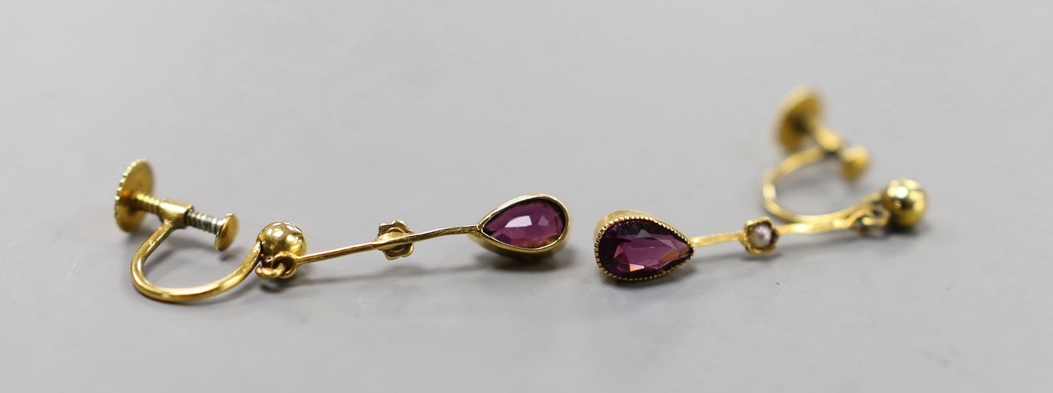 A pair of 9ct, amethyst and seed pearl set drop earrings, 20mm, gross weight 1.4 grams and a George V silver and Scottish hardstone mounted sword brooch, 11.8cm.